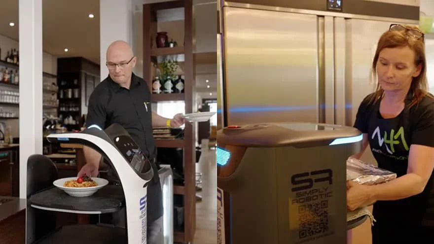 Parkhotel staff load and unload food on Pudu service robots inside the hotel's restaurant.