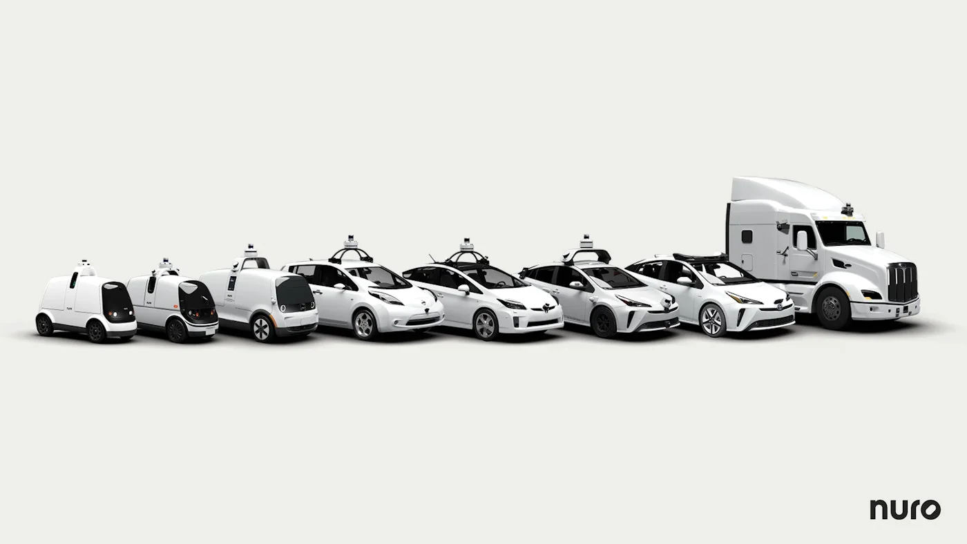 Lineup of passenger cars, delivery vehicles and a truck representing platforms equipped with the Nuro Driver