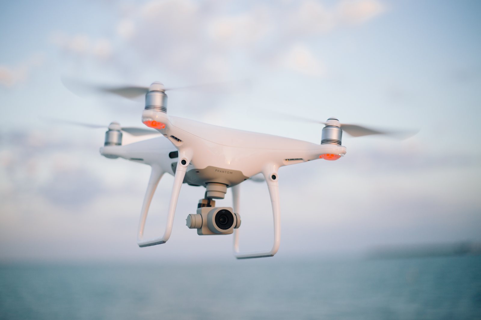 A DJI Phantom 4 Pro camera drone in flight